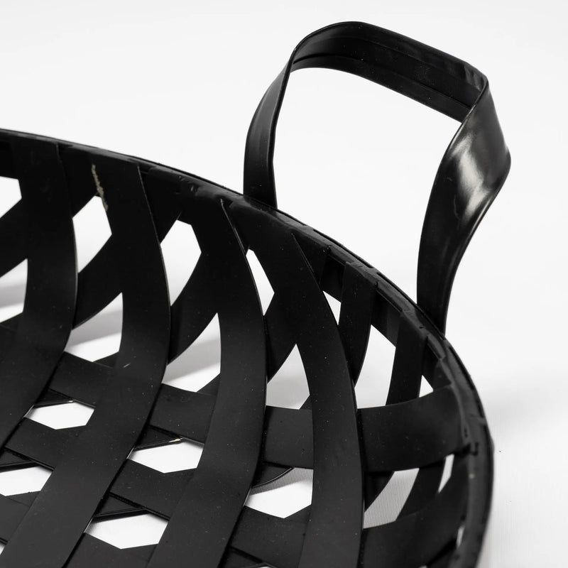 Black woven plastic storage basket with handles, perfect for organizing and home decor.