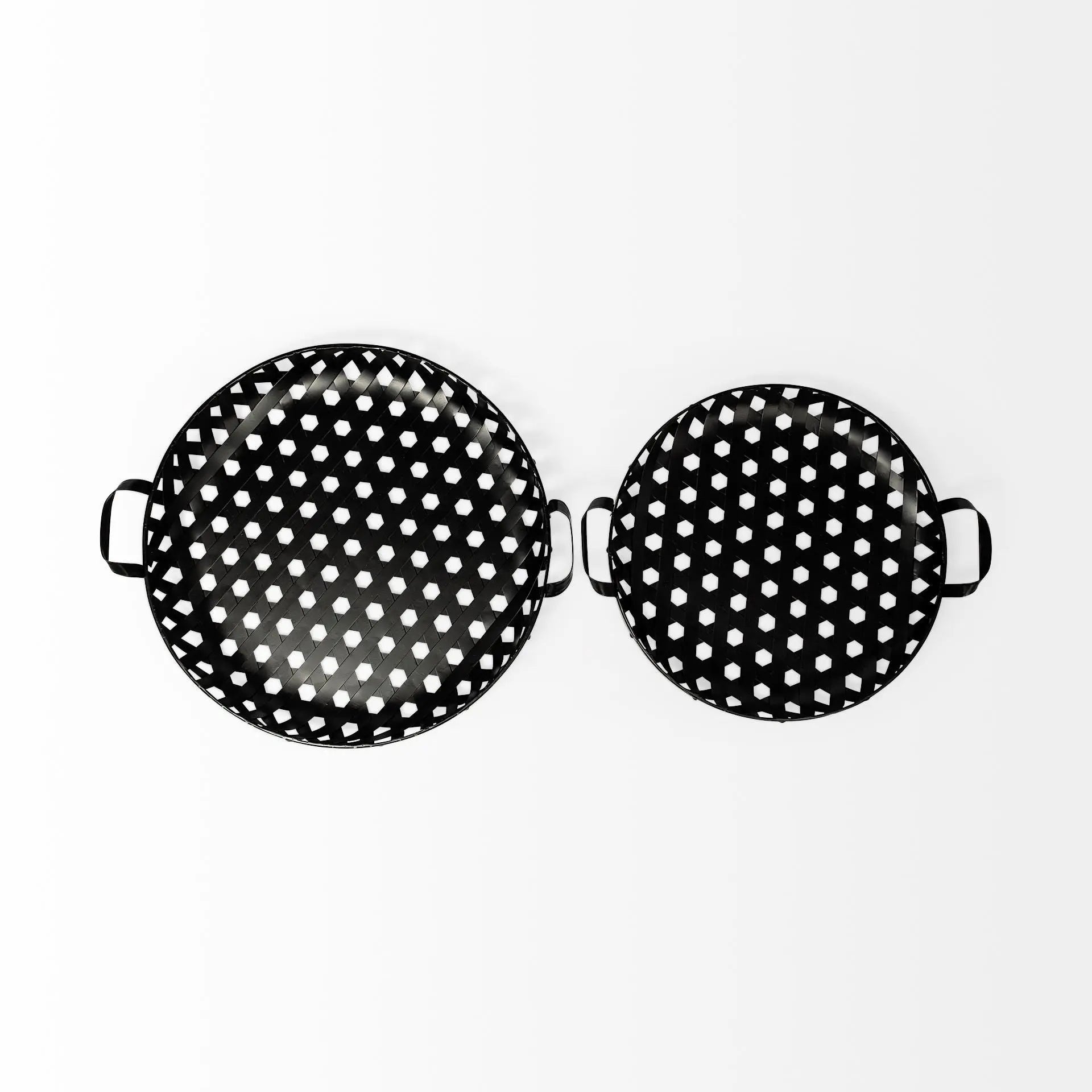Set of two black and white polka dot serving trays, made of durable metal with stylish handles.