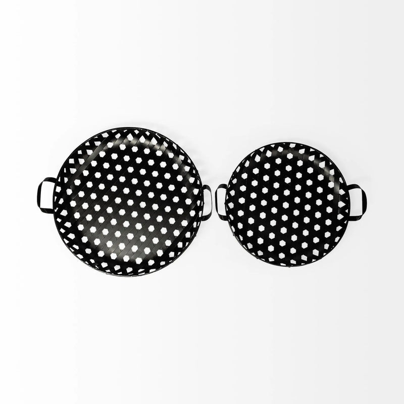Set of two black and white polka dot serving trays, made of durable metal with stylish handles.