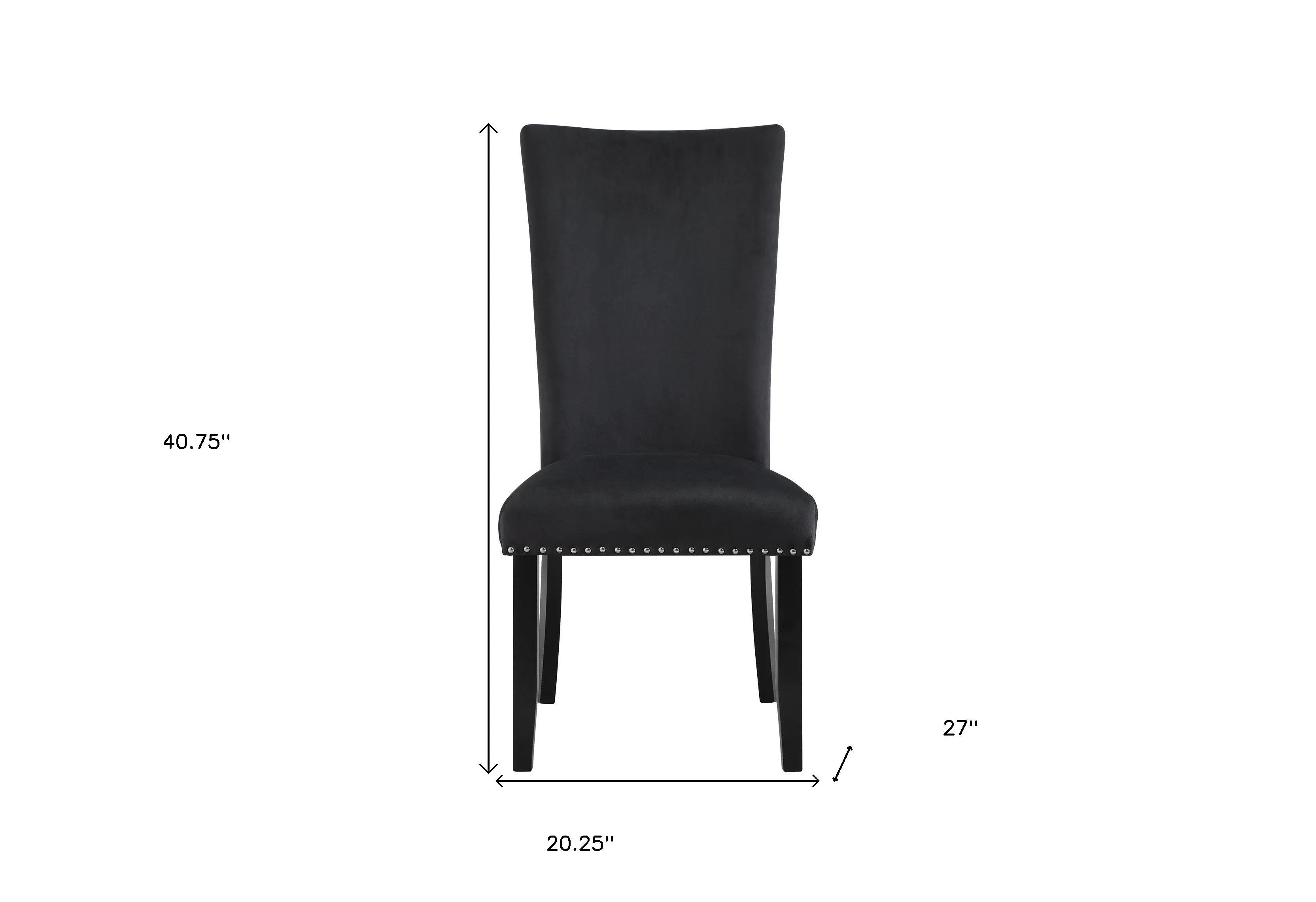 Elegant black velvet dining chair with nailhead trim and sleek wooden legs, perfect for upscale décor.