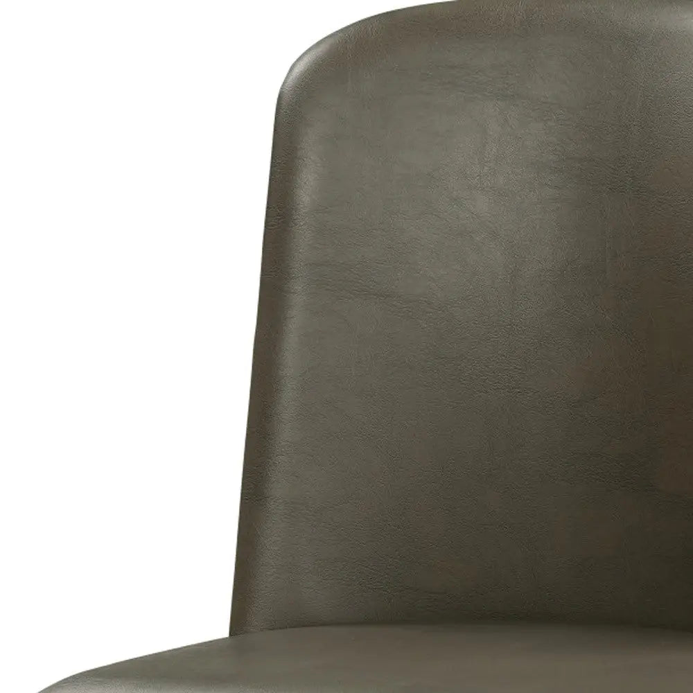 Olive green leather dining chair with a minimalist design and smooth, curved backrest.