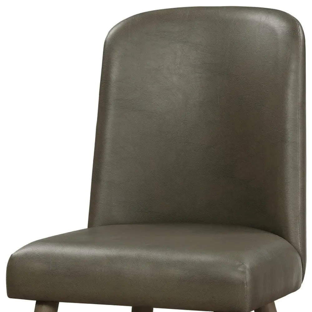 Dark olive green faux leather dining chair with a sleek, minimalist design. Perfect for modern interiors.