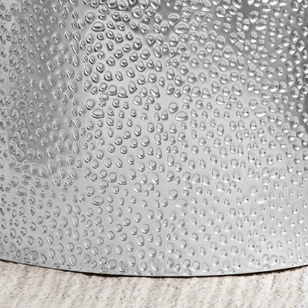 Silver hammered metal bucket with a textured finish, ideal for storage or decor in modern spaces.