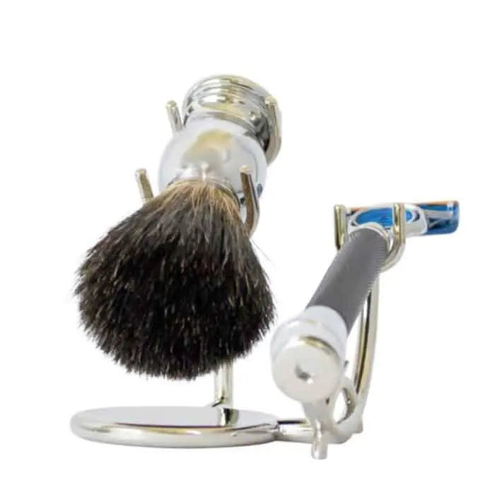 Silver chrome shaving brush set with black handle and blue resin accents, featuring a classic design and sturdy stand.