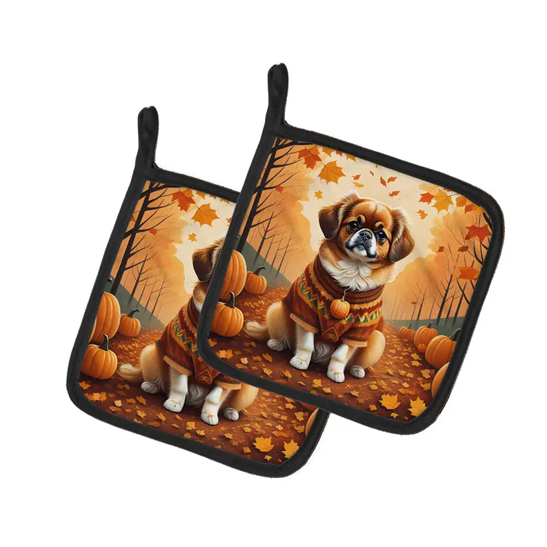 Fall-themed dog pot holders featuring a Pekingese in a cozy sweater, set against autumn leaves and pumpkins.