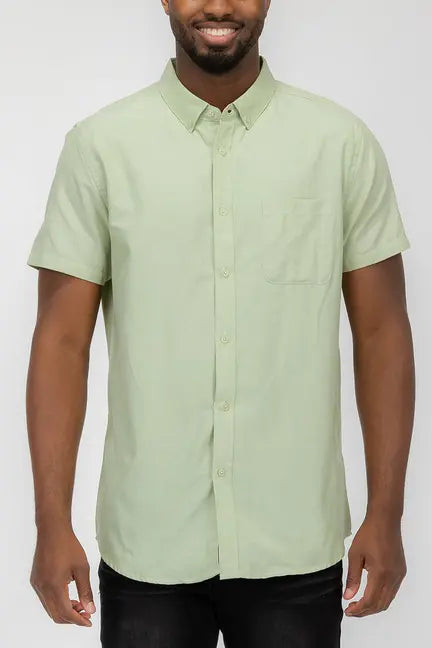 Short-sleeve mint green button-up shirt in lightweight cotton with a single chest pocket.