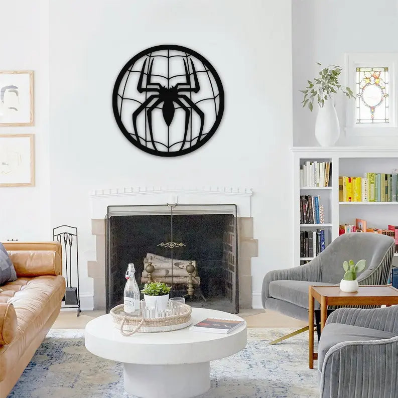 Black spider wall art in a modern living room, featuring a geometric design and minimalist decor elements.