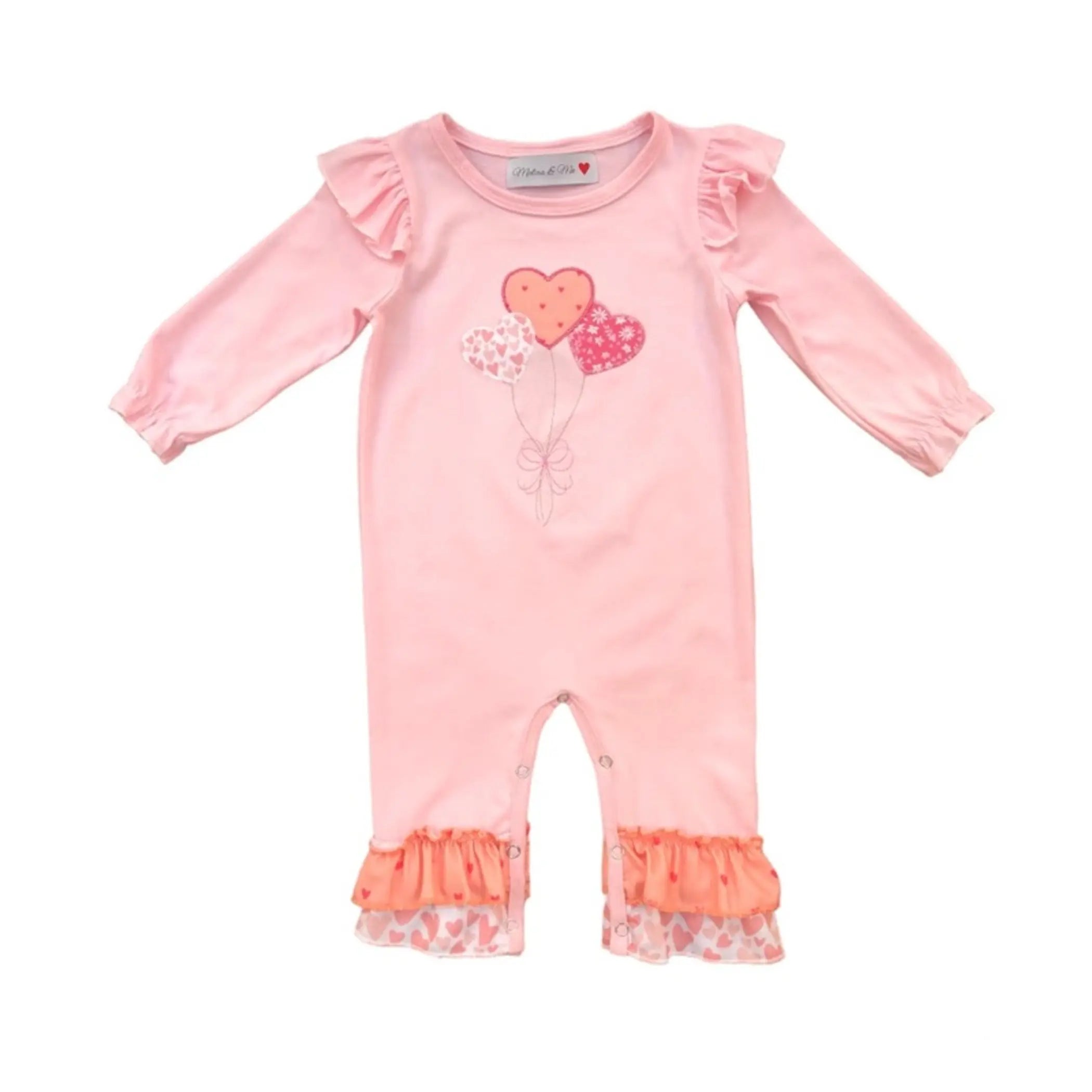 Pink baby romper with heart balloon graphics, ruffle sleeves, and heart-patterned cuffs, made from soft cotton.