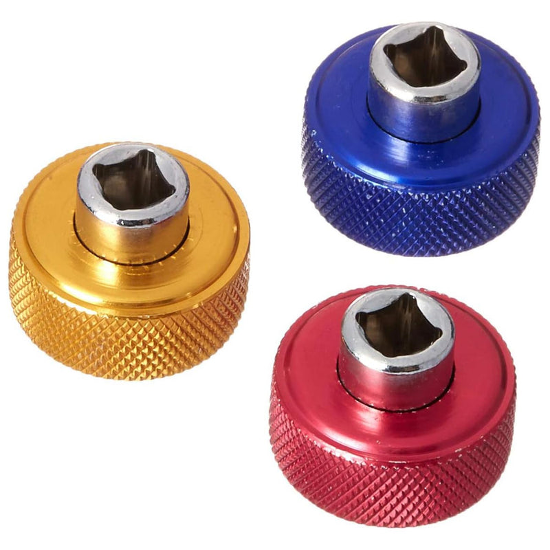 Close-up of bit driver sockets on gold, blue, and red finger-grip caps