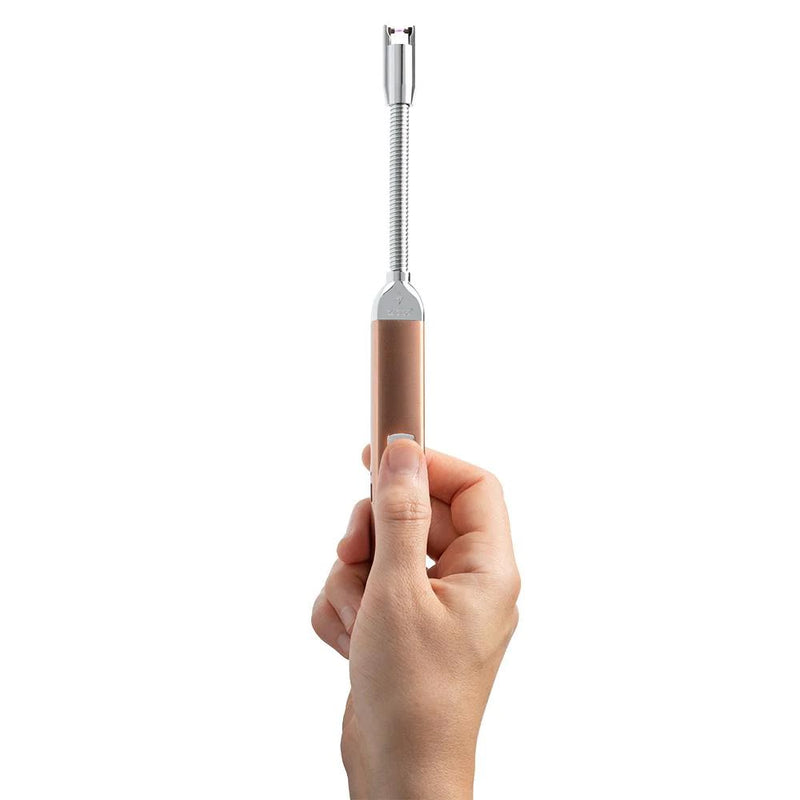 Hand holding rose gold Zippo rechargeable flexible-neck candle lighter