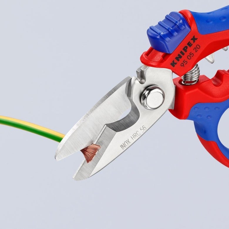 Knipex angled electricians' shears close-up with green/yellow wire and silver blades