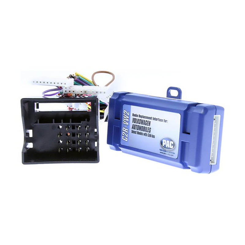 Car radio replacement interface with open black connector housing and blue PAC module