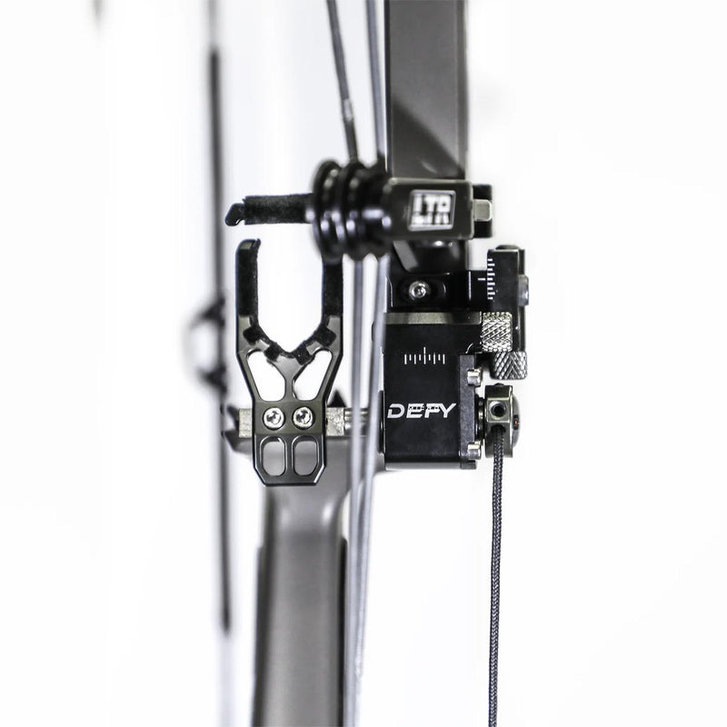 Black drop-away arrow rest close-up with DEFY unit and support spring