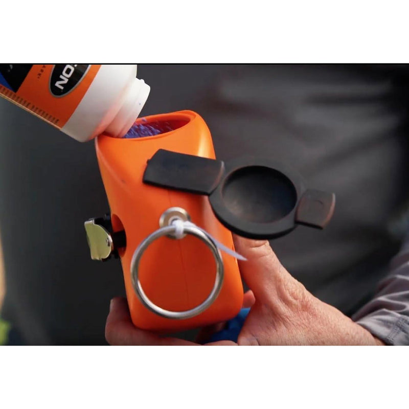 Orange chalk line reel with black thumb latch, gray ring handle, and metal eyelet