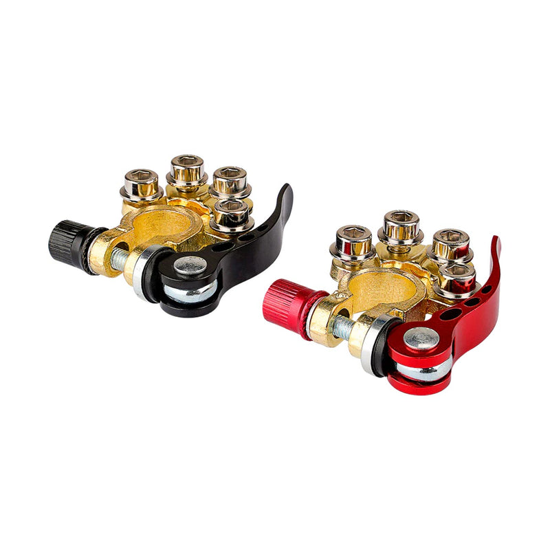 Quick-release battery terminal pair, angled view with black/red housings and gold connection points