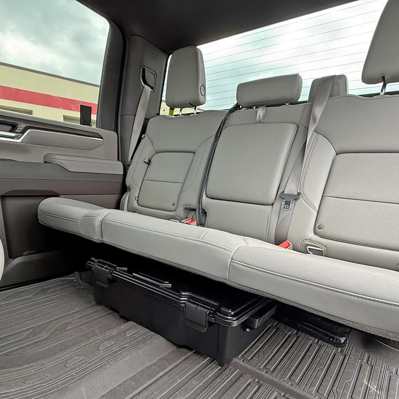 Truck bench cargo area with black storage crate under the seat