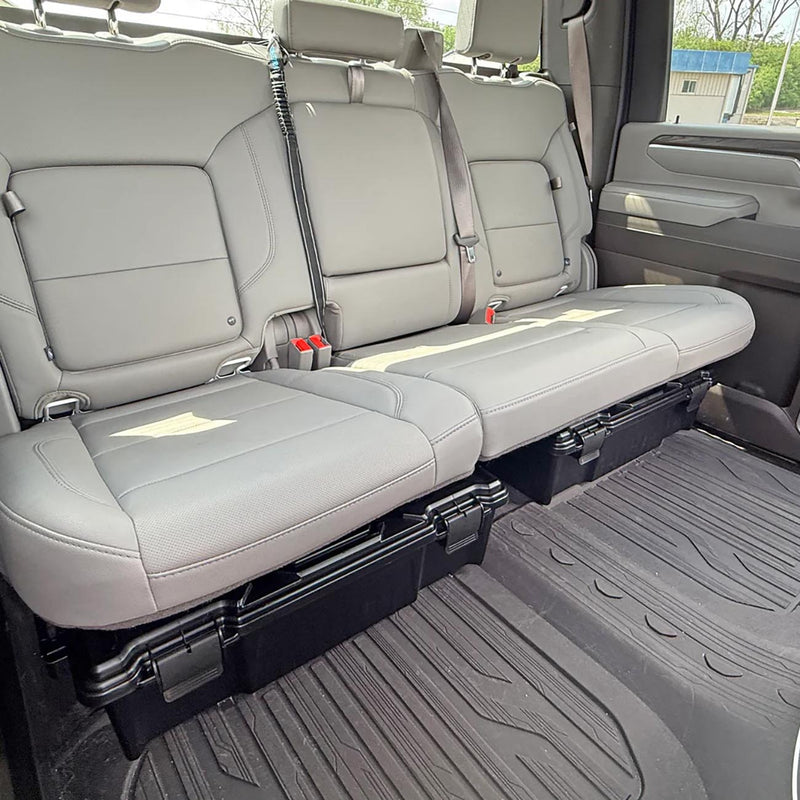 Black under-seat storage crate positioned under rear seat for flat cargo space