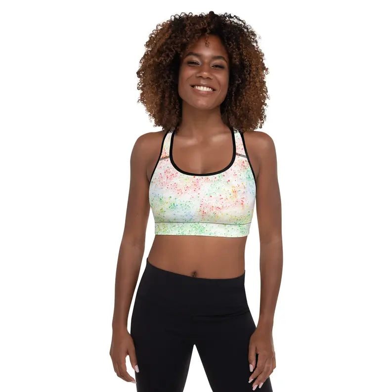 Multicolor speckled sports bra with black straps, ideal for workouts and casual wear. Soft, stretchy fabric.