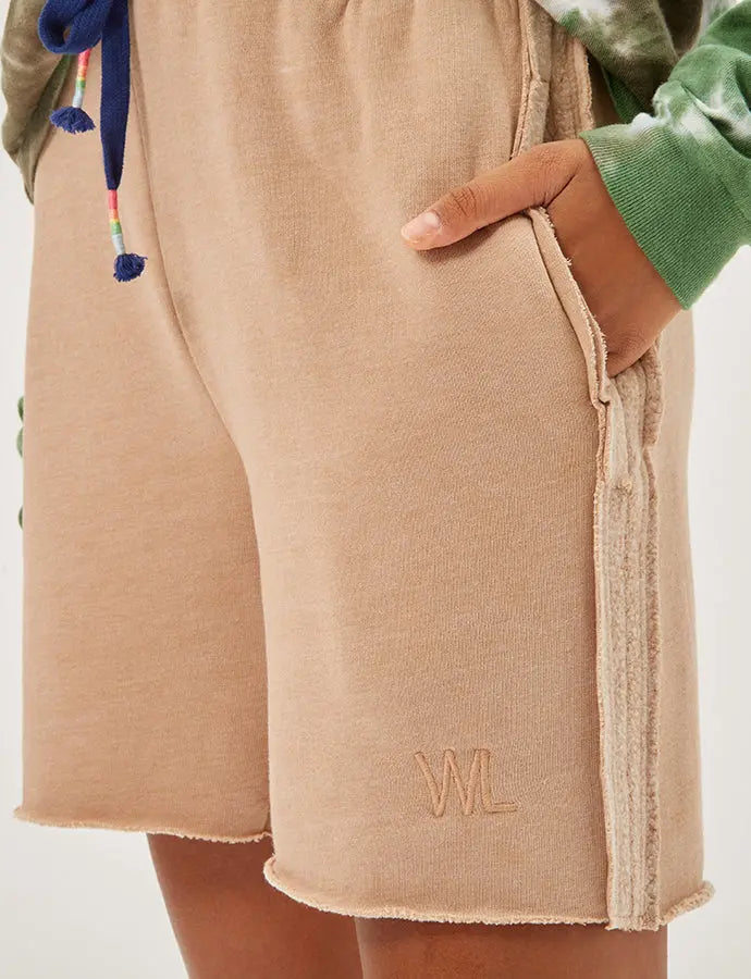 Beige cotton blend shorts with side pockets and textured stripe detail, featuring an embroidered logo.