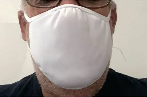 White cotton face mask for adults, breathable fabric, comfortable fit, ideal for daily wear and protection.