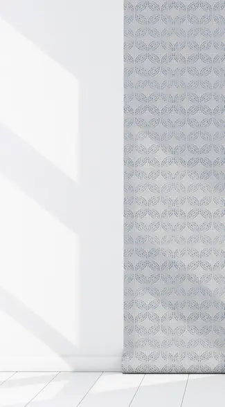 Light blue patterned roller blind in elegant geometric design, perfect for modern home décor.
