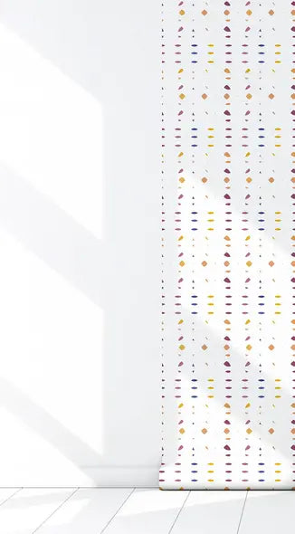 Bright multicolored geometric patterned roller shade on a white wall, perfect for modern home decor.
