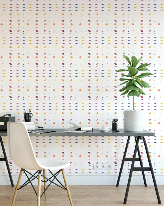 Bright patterned wallpaper featuring pink, yellow, and blue geometric shapes on a white background, ideal for modern decor.