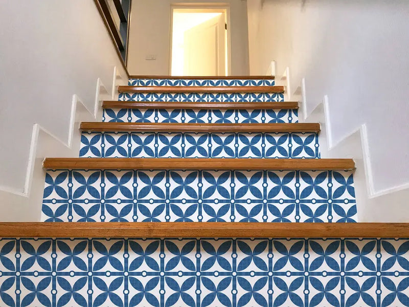 Blue and white geometric pattern stair risers with wooden steps, ideal for stylish home decor.