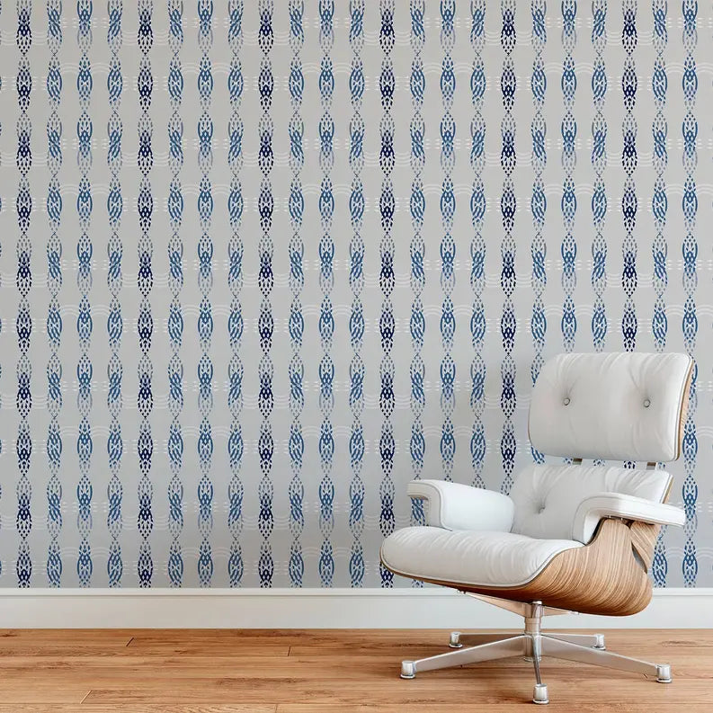 Blue and white patterned wallpaper featuring a modern design, paired with a sleek white and wood chair.
