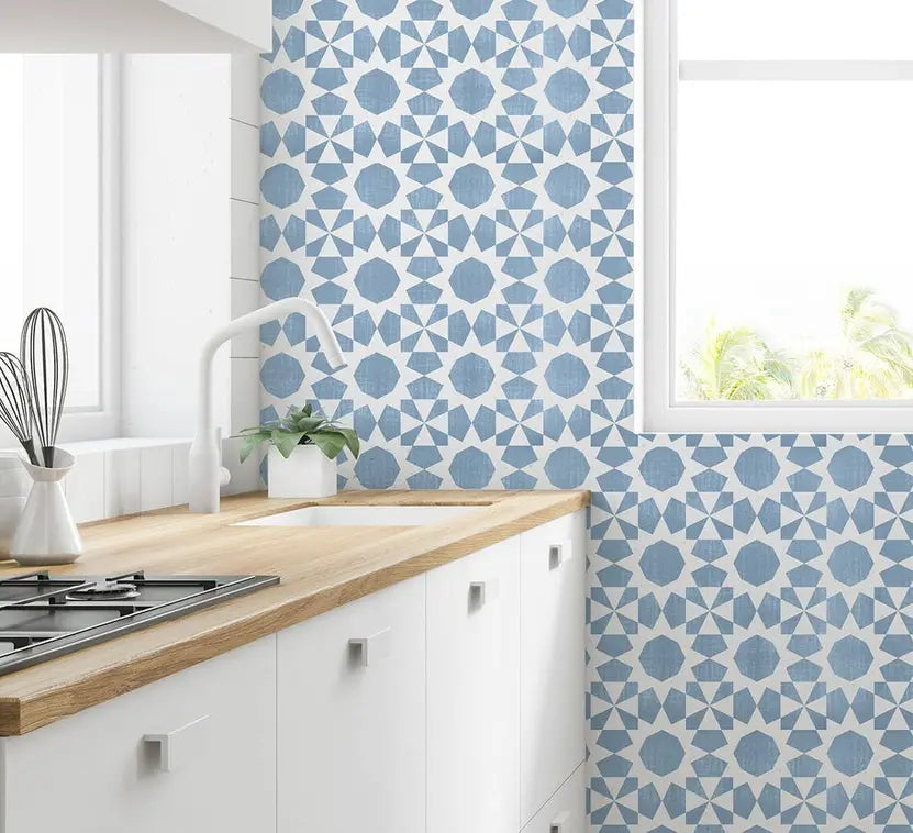 Light blue geometric tile wallpaper in a modern kitchen setting, featuring a stylish star pattern against a white backdrop.