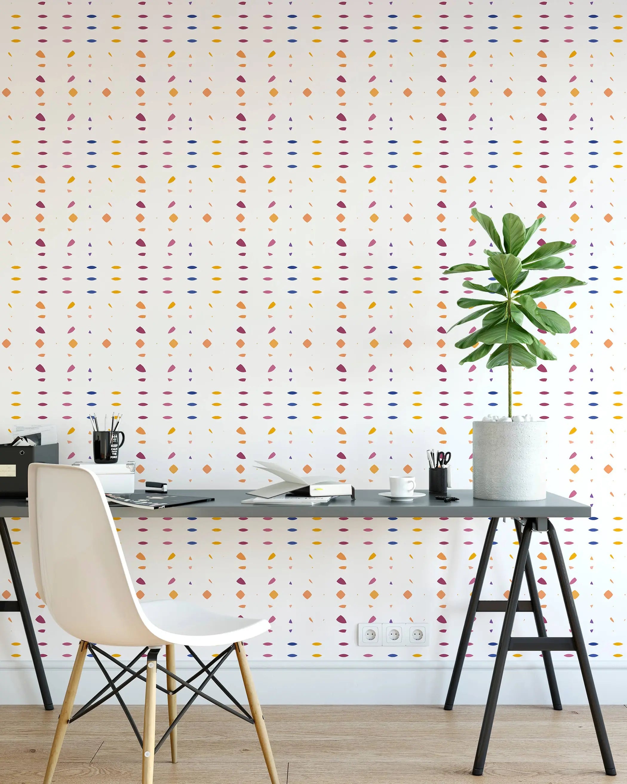 Colorful geometric pattern wallpaper in white, featuring yellow, pink, and blue shapes, perfect for modern home decor.