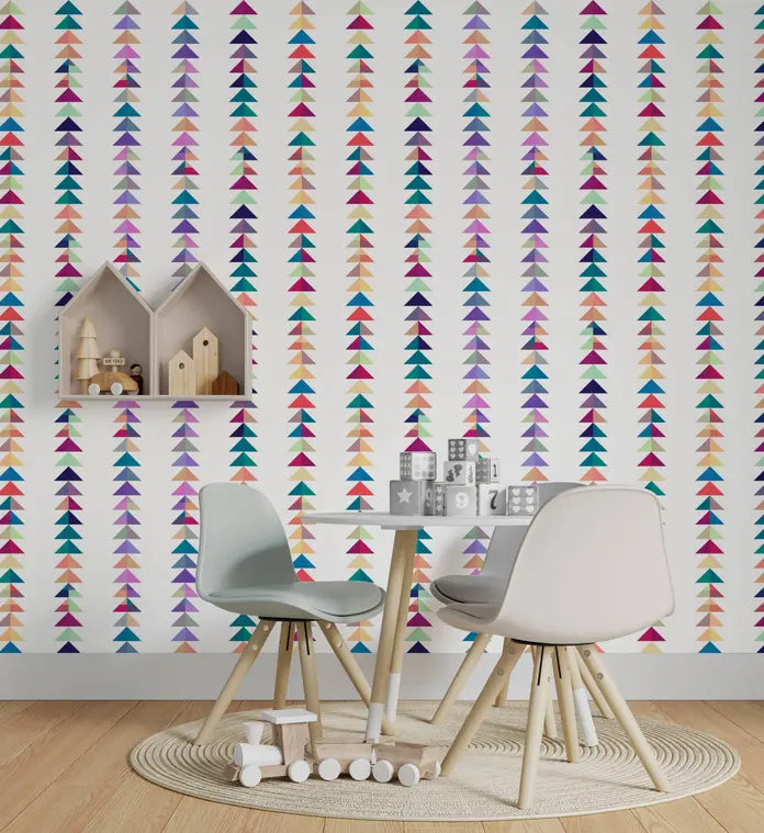 Colorful arrow-patterned wallpaper in pastel hues, featuring a modern playroom setup with light chairs and minimalist decor.