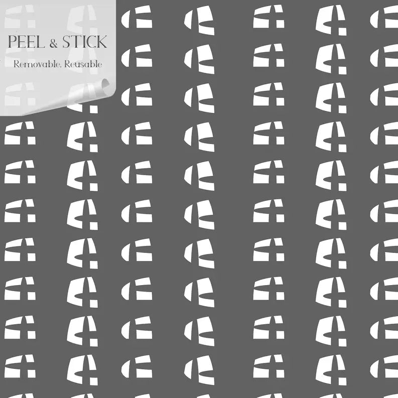 Gray peel-and-stick wallpaper featuring a modern white geometric pattern, removable and reusable for easy application.