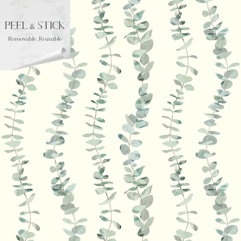 Peel and stick wallpaper featuring soft green eucalyptus leaves on a cream background, removable and reusable.