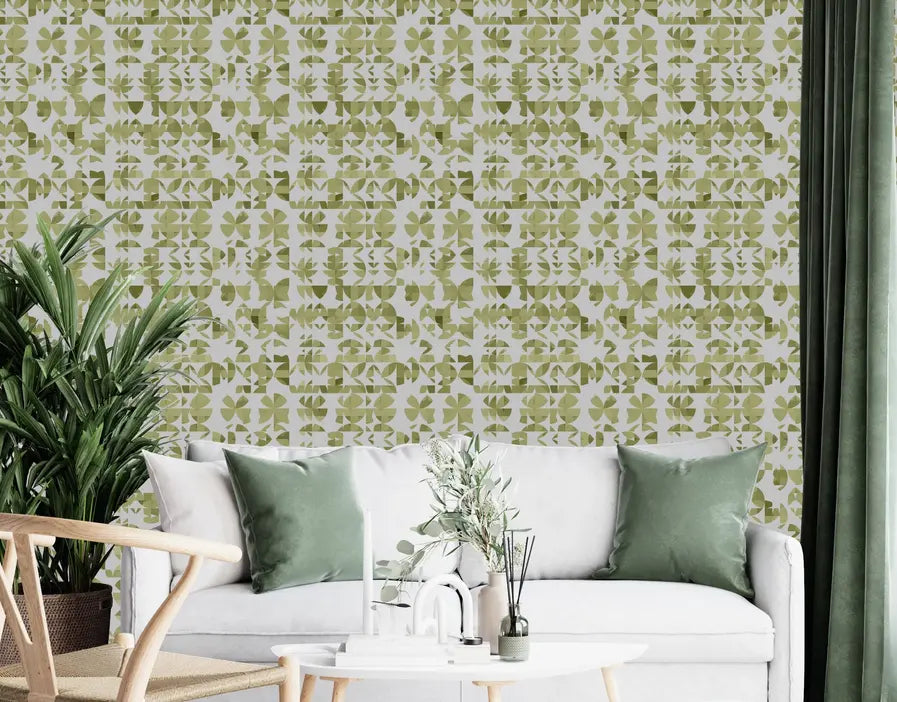 Green and beige floral wallpaper with a modern pattern, accentuating a cozy living room with white sofa and green cushions.