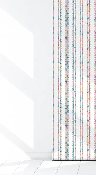 Colorful floral striped roller blinds in pastel shades on a bright white wall, perfect for vibrant home decor.