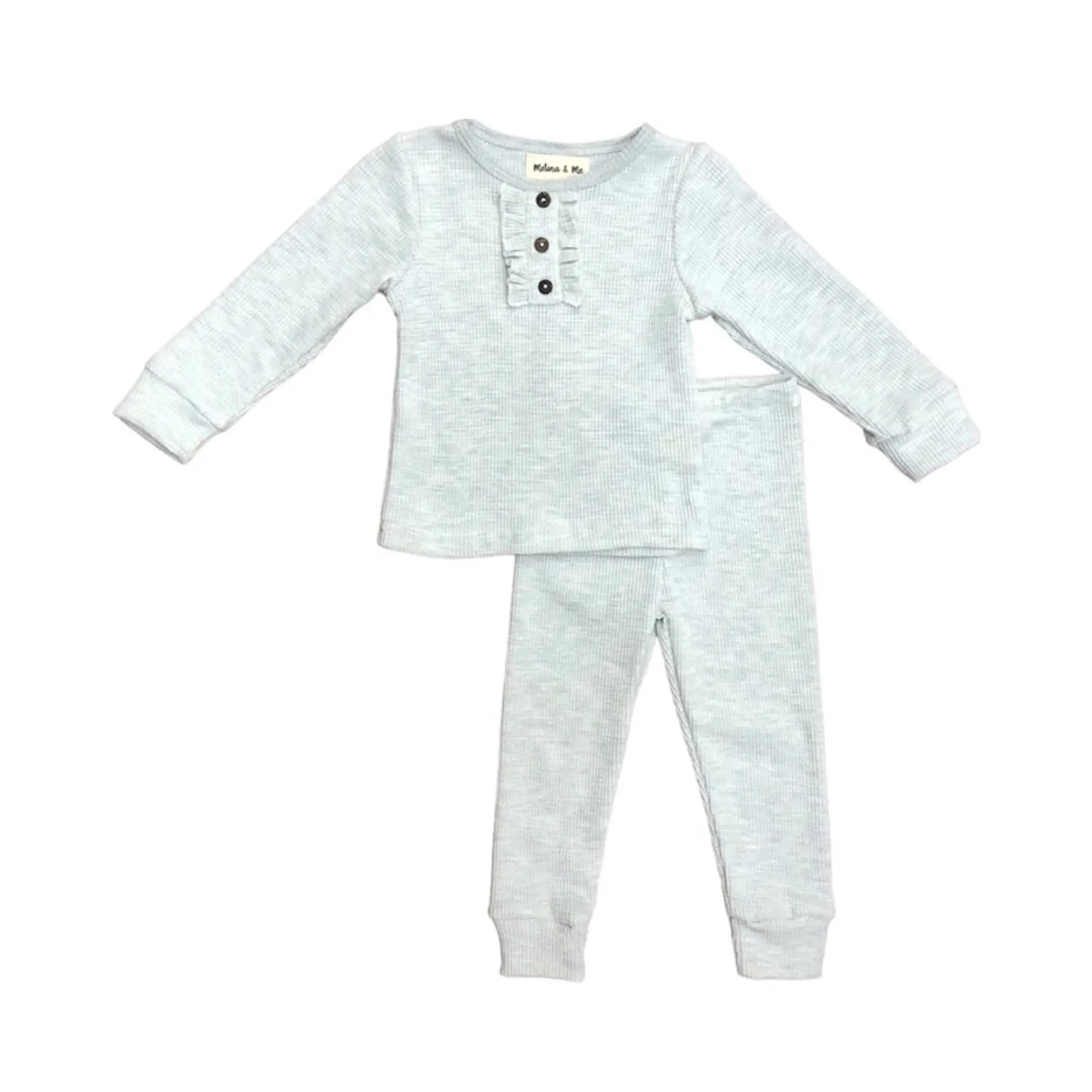 Light gray ribbed toddler pajama set with button detail, featuring long sleeves and snug-fitting pants.