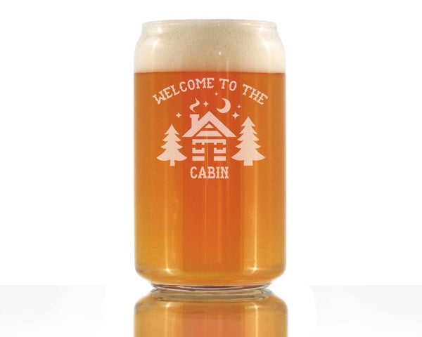 "Clear glass canister with 'Welcome to the Cabin' design, featuring trees, for craft beer lovers."