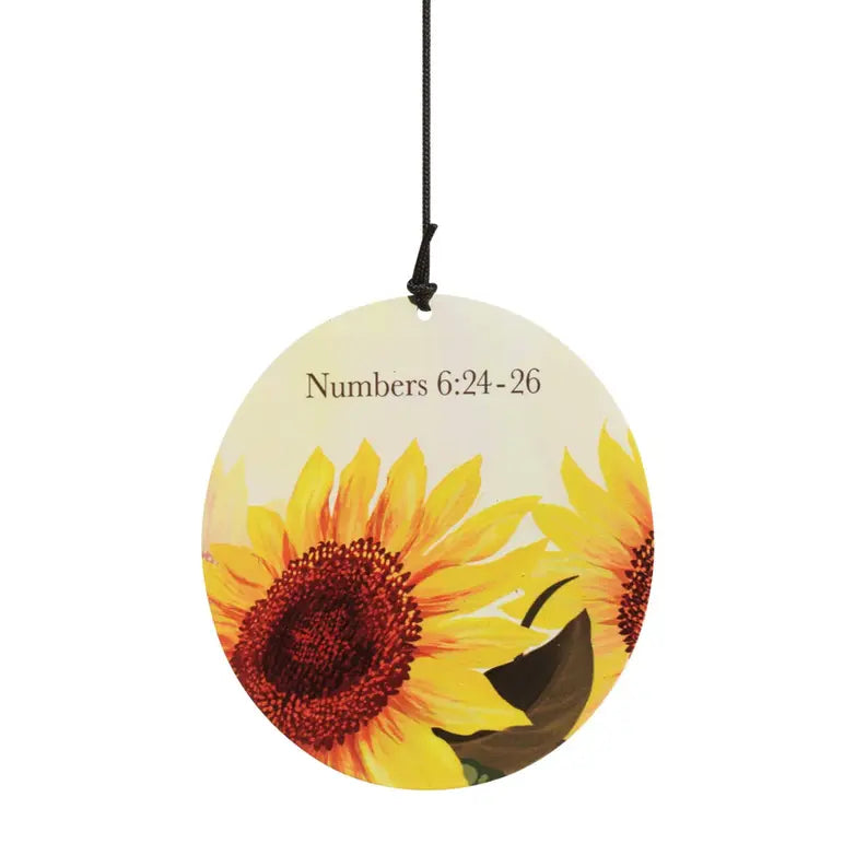 Round floral wall art featuring sunflowers in vibrant yellow and red, with "Numbers 6:24-26" printed on a cream background.