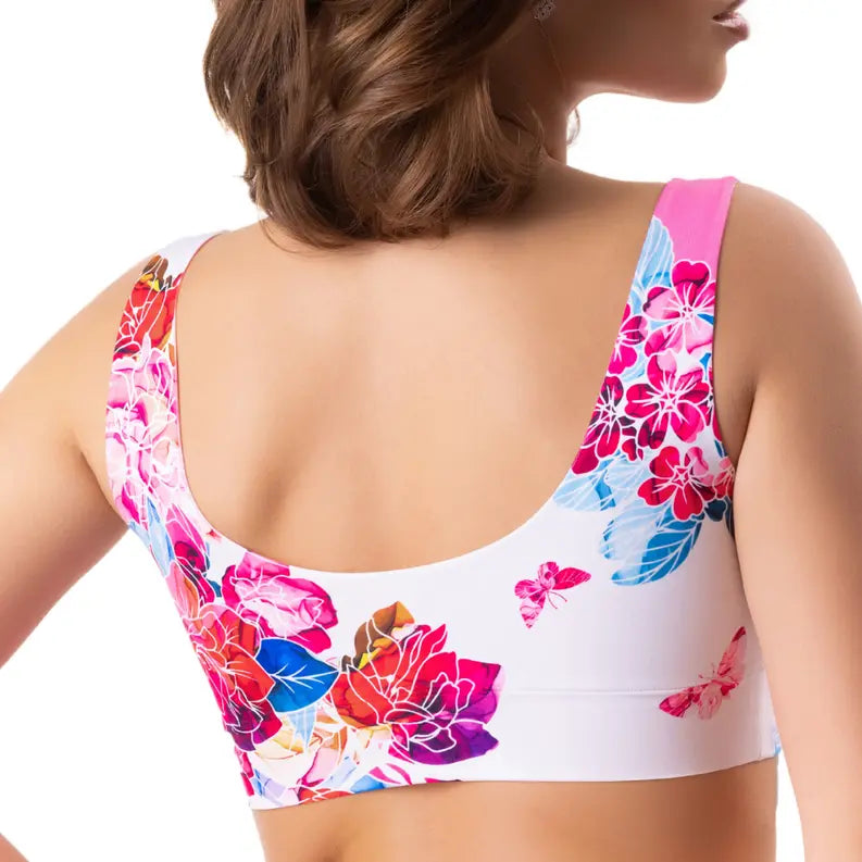 Colorful floral print women's sports bra in pink, blue, and white, featuring a stylish back design.